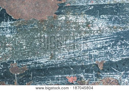Aged weathered and peeling paint surface background.