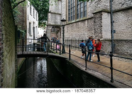 Gouda Netherlands - August 4 2016: Picturesque street and canal in the dutch city of Gouda