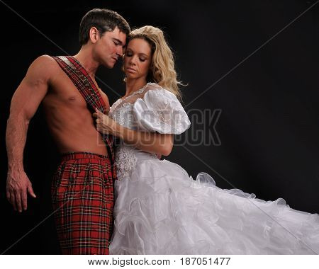 The sexy lady is hugging her highlander.