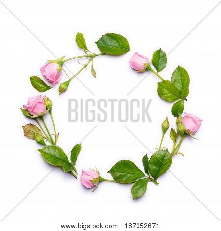 Round frame of delicate flowers. Pink roses isolated on white background. Top view, flat design.