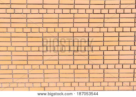 A Wall Of Cracked Bricks With Fresh Cement Joints