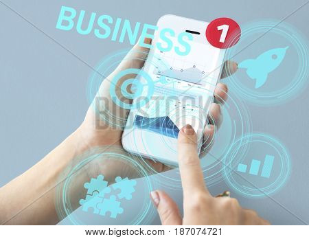 Hands working on digital device network graphic overlay