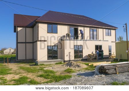 New house under construction on the field