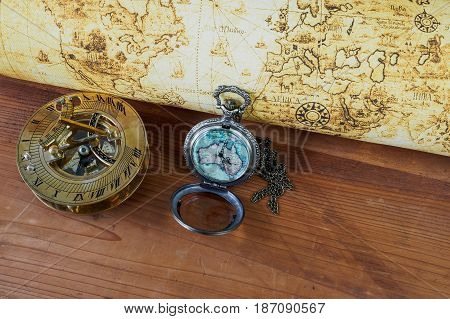 Pocket watch on vintage map. Retro style.