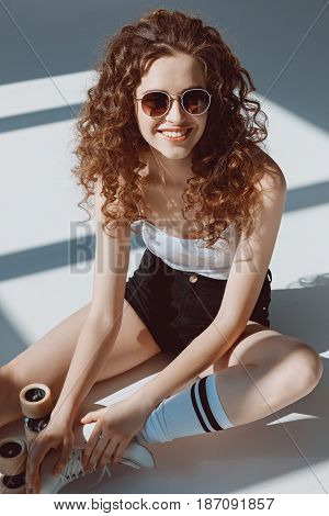 beautiful red hair hipster girl sitting on the floor hipster girl smiling