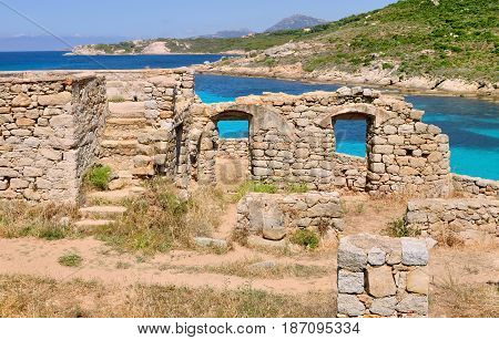 ancient ruins in Corsica island in front of turquoise sea