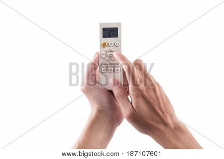Right hand holding remote air conditioner turn up to 27 celcius with air conditioner.