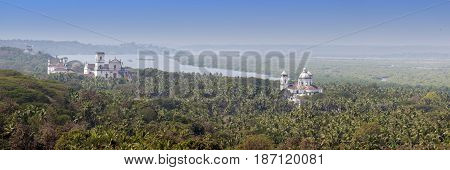 Aerial panoramic view Old Goa. Mandovi river and ancient Churches