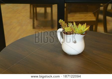 wooden table in front of blurred background in cafe