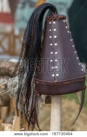 Dacian combat helmets exposed at an antique arms exhibition.