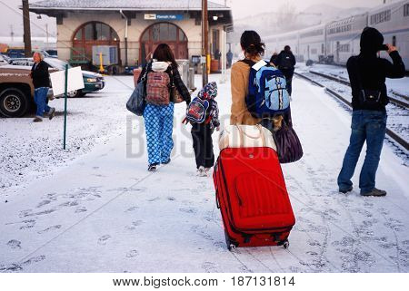 KLAMATH FALLS, OREGON, USA - February 25, 2012: Passengers disembark from an Amtrak train in snowy weather