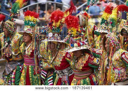 ORURO, BOLIVIA - FEBRUARY 26, 2017: Tinkus dance group in ornate costumes performing as they parade through the mining city of Oruro on the Altiplano of Bolivia during the annual carnival.