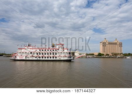 Savannah GA - March 27 2017: The Georgia Queen is an 1800s style paddlewheel riverboat and tourist attraction in historic Savannah Georgia. It can accommodate up to 1000 passengers and is the newest member of the Savannah Riverboat Cruise fleet.