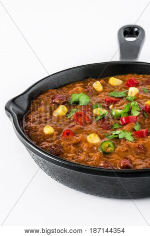 Traditional mexican tex mex chili con carne in a frying pan isolated on white background