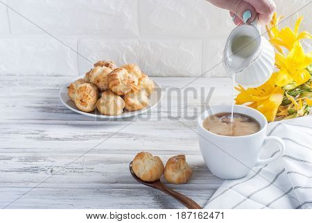 Coffee And Eclairs On A White Background