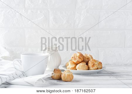 Coffee And Eclairs On A White Background