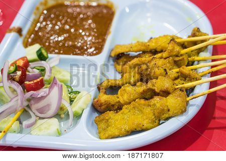 Pork Satay. grilled pork served with peanut sauce or sweet and sour sauce.