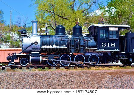 May 3, 2017 in Golden, CO:  Vintage steam locomotive in a railroad yard at the Colorado Railroad Museum where visitors can observe locomotives and rail cars on display in Golden, CO