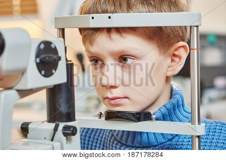 Children ophthalmology. Boy under optometrist test