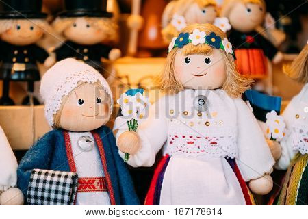 Traditional Souvenirs Ethnic Folk National Wooden Dolls Toys At European Estonian Market. Popular Souvenir From Tallinn, Estonia