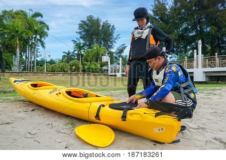 Labuan,Malaysia-Feb 19,2017:Group of adventurer ready to kayaking in Labuan island,Malaysia.Malaysia is the ideal place for water sports,like white water rafting,kayaking,scuba diving & sailing.