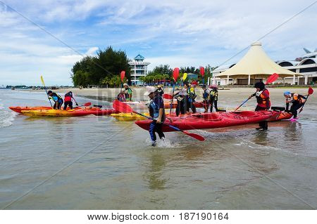 Labuan,Malaysia-Feb 19,2017:Group of adventurer ready to kayaking in Labuan island,Malaysia.Malaysia is the ideal place for water sports,like white water rafting,kayaking,scuba diving & sailing.