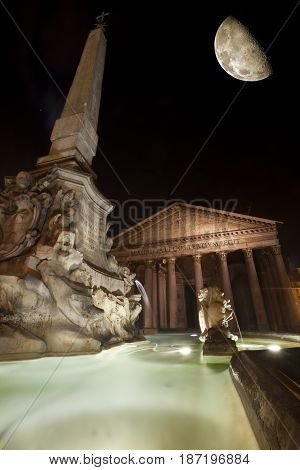 Pantheon, historic building landmark in Rome, Italy. Night. Commissioned by Marcus Agrippa during the reign of Augustus (27 BC - 14 AD) and rebuilt by the emperor Hadrian about 126 AD. Big half moon.