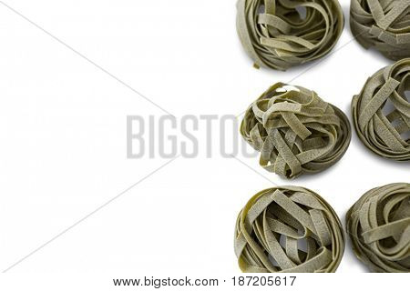 Close up of tagliatelle on white background