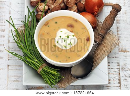 Creamy Mushroom Soup on wooden white background