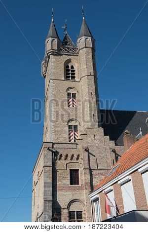 Church in Sluis Holland in bright blue sky