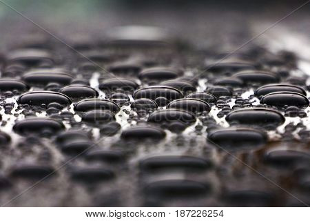 Drops of water on the roof color, nature background close up