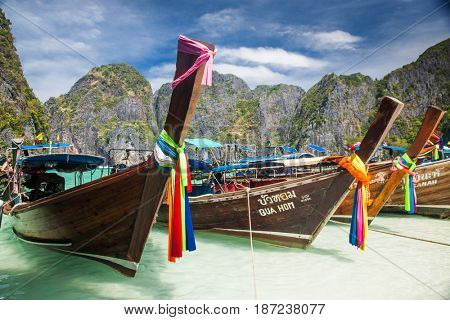KO PHI PHI LEH, THAILAND, February 1, 2014: Traditional long tail boats on the beach of Maya Bay, Andaman Sea, famous tourist destination in the Ko Phi Phi achipelago