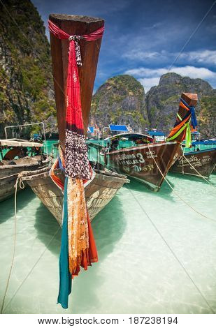 KO PHI PHI LEH, THAILAND, February 1, 2014: Traditional long tail boats on the beach of Maya Bay, Andaman Sea, famous tourist destination in the Ko Phi Phi achipelago
