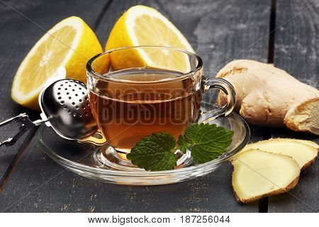 Tea. Herbal Tea. Mint Leaf. Tea In A Glass Cup, Mint Leaves, Dried Tea, Sliced Lime. Herbs On A Slat