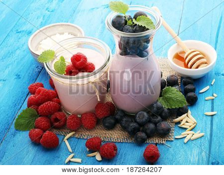 Beautiful Appetizer Pink Raspberries Fruit Smoothie Or Milk Shake In Glass Jar With Berries Backgrou