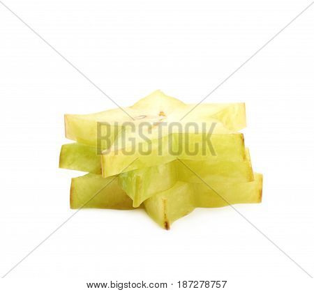 Pile of sliced carambola starfruit fruits isolated over the white background