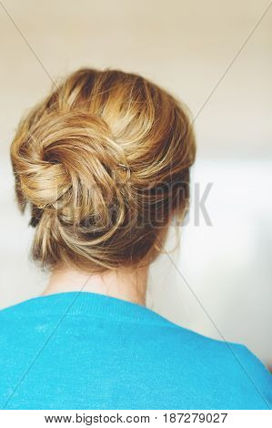 Back view of beautiful hairpiece style, blond hair