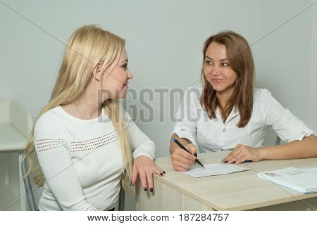 Beautiful young girl on examination with a doctor in a polyclinic