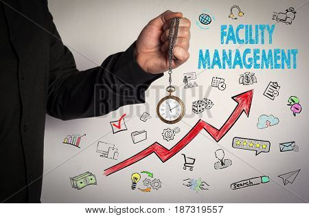 Facility Management concept. Red Arrow and Icons Around. Man holding chain clock on white background.
