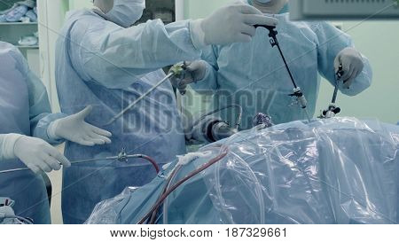 Laparoscopic surgery of the abdomen. The team of medical specialists conducting laparoscopic surgery.