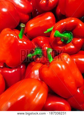 Bright red sweet pepper in a wooden box.