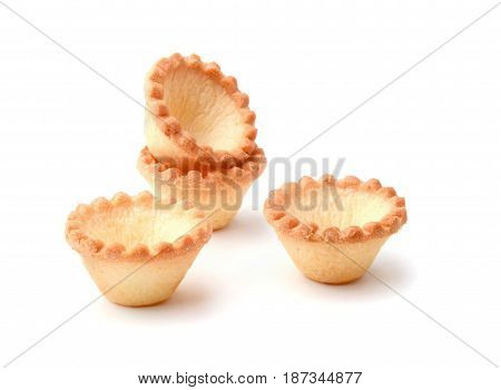 Group of small tartlets isolated on white