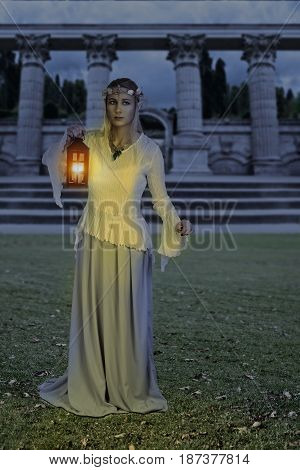 female high elf with lantern at night