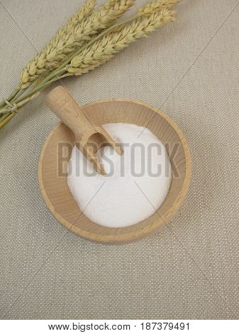 Dextrose from wheat starch in wooden bowl