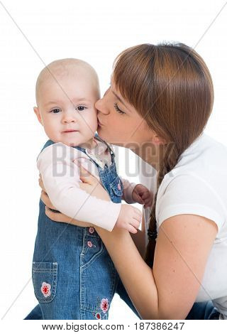 Happy Mother kissing her Baby. Isolated on white background.