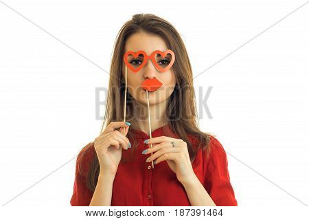 young charming girl stands in front of the camera and holds near person paper Dummies for photo isolated on a white background