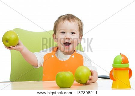 littlle boy with green apples isolated on white