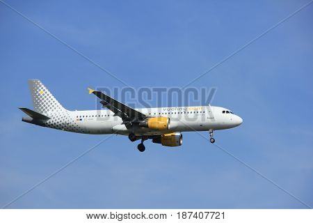 Amsterdam the Netherlands - July 21st 2016: EC-KHN Vueling Airbus A320 approaching Polderbaan runway at Schiphol Amsterdam Airport arriving from Porto Rome