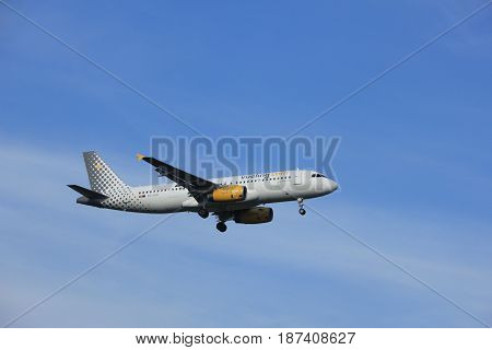 Amsterdam the Netherlands - July 21st 2016:EC-LUN Vueling Airbus A320 approaching Polderbaan runway at Schiphol Amsterdam Airport arriving from Naples