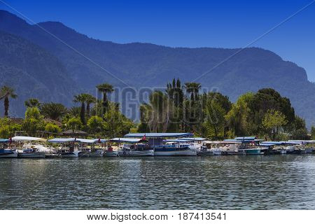 TURKEY, MUGLA ,DALYAN, - 5 MAY , 2017: The Dalyan River with tourist boats in the straits of the river